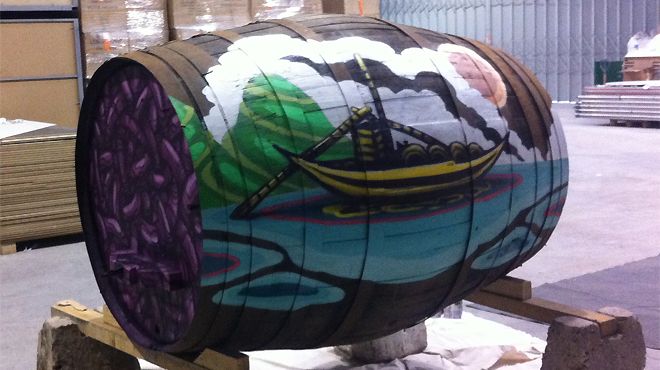 Street artwork painted on the side of a wine barrel by artist - Giencolo Mard. Street art is an integral part of Portugals culture and cuisine is represented by the use of the wine barrel.