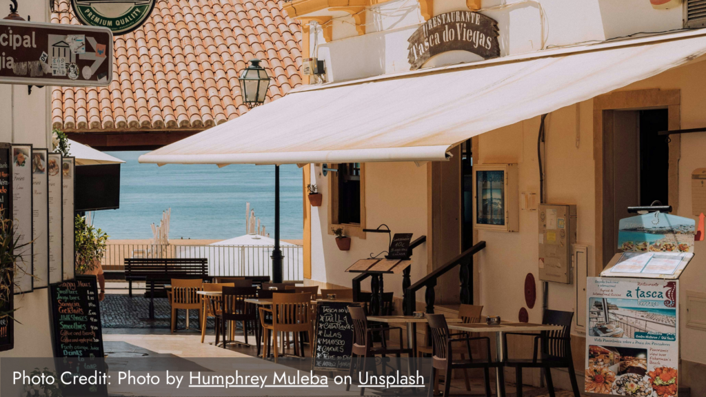 A picture of the outside cafe portion of a restauratn in Lisbon called Tasca do Viegas where you can experience portuguese culture and cuisine