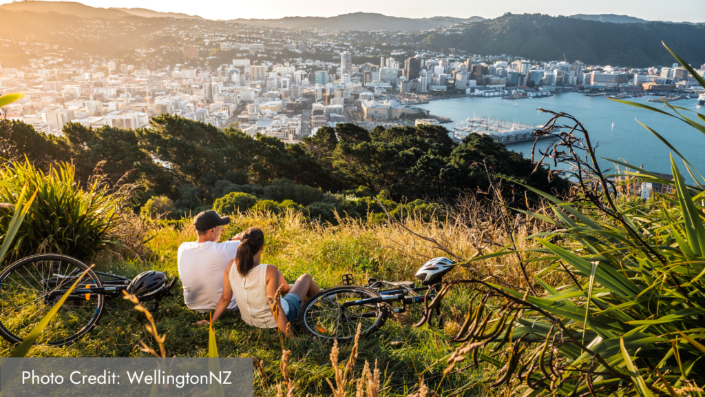 Wellington Mount Victoria 2 people laying in the grass with their bicycles on the Kapiti Coast, New Zealand.