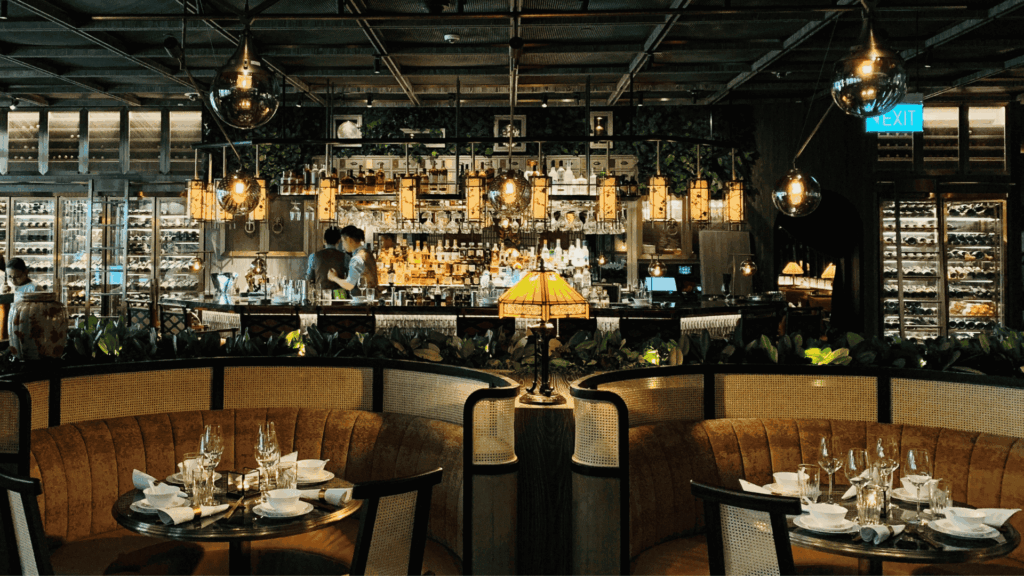 Chic and modern restaurant bar with elegant booth seating and warm lighting – American foodie travel dining ambiance